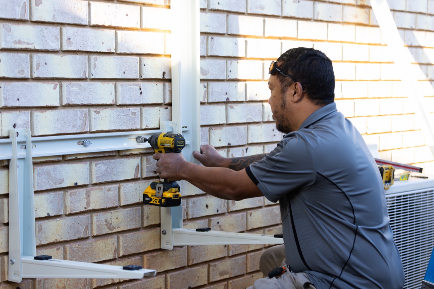 Technician installing a split system
